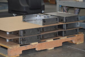 Electronics enclosures being stacked on a pallet